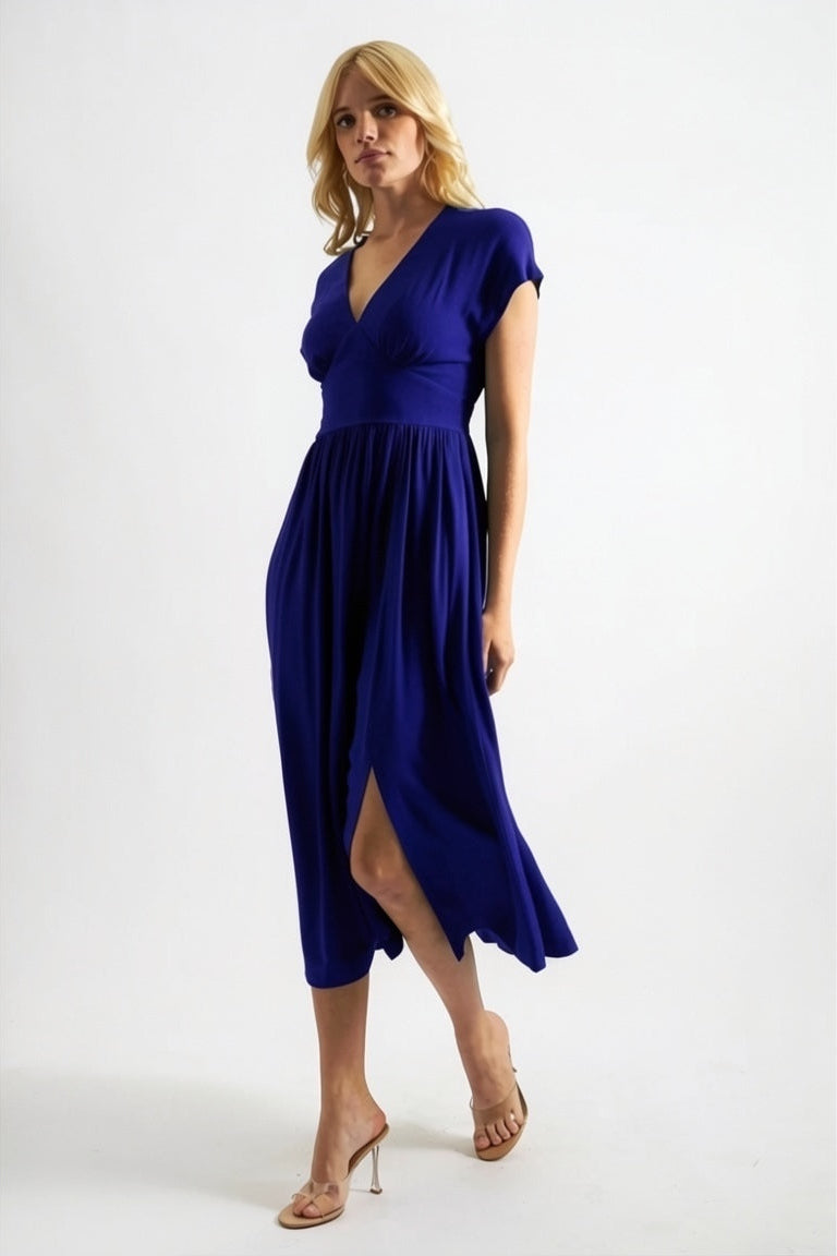 Woman wearing a blue dress on a white background