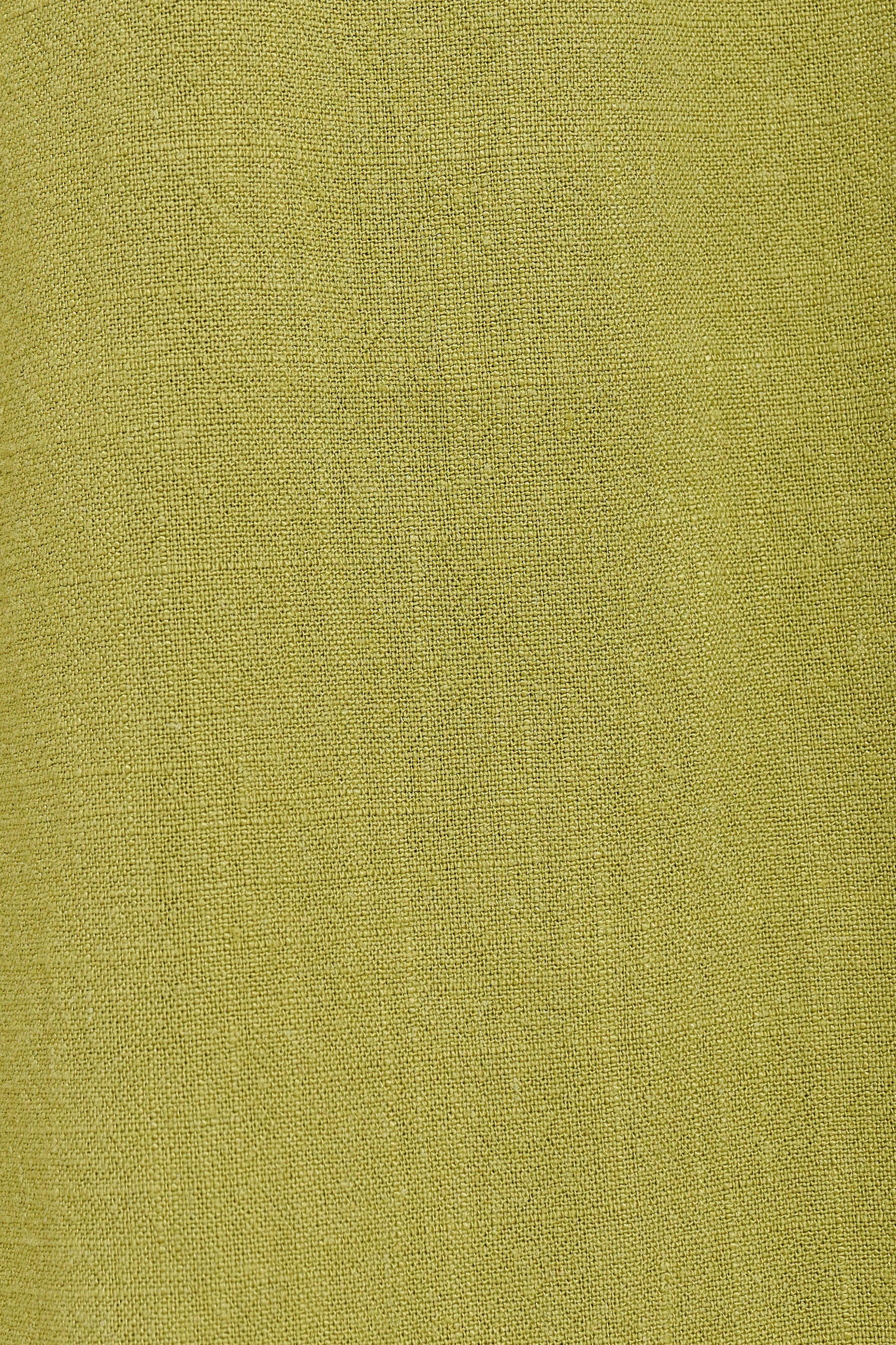 A close-up of a textured fabric in a muted olive yellow-green color.