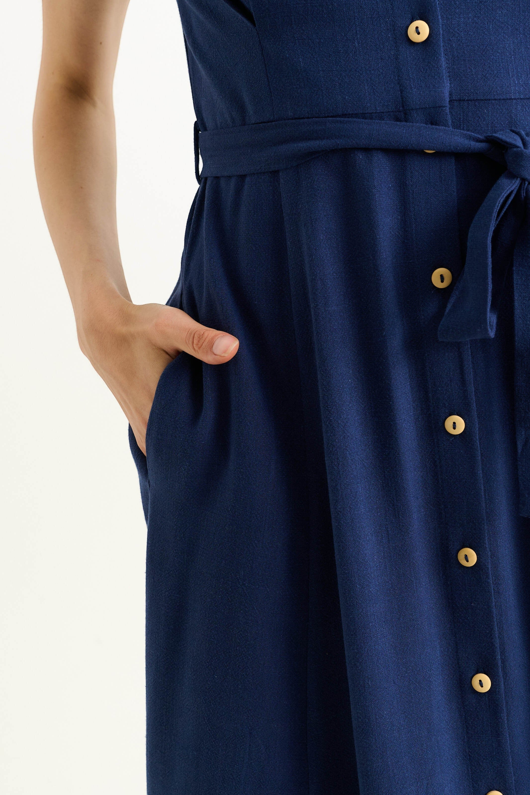 Navy linen mix midi shirt dress with self-tie belt, button front, and side pockets. Features wooden buttons and elasticated cuffs.