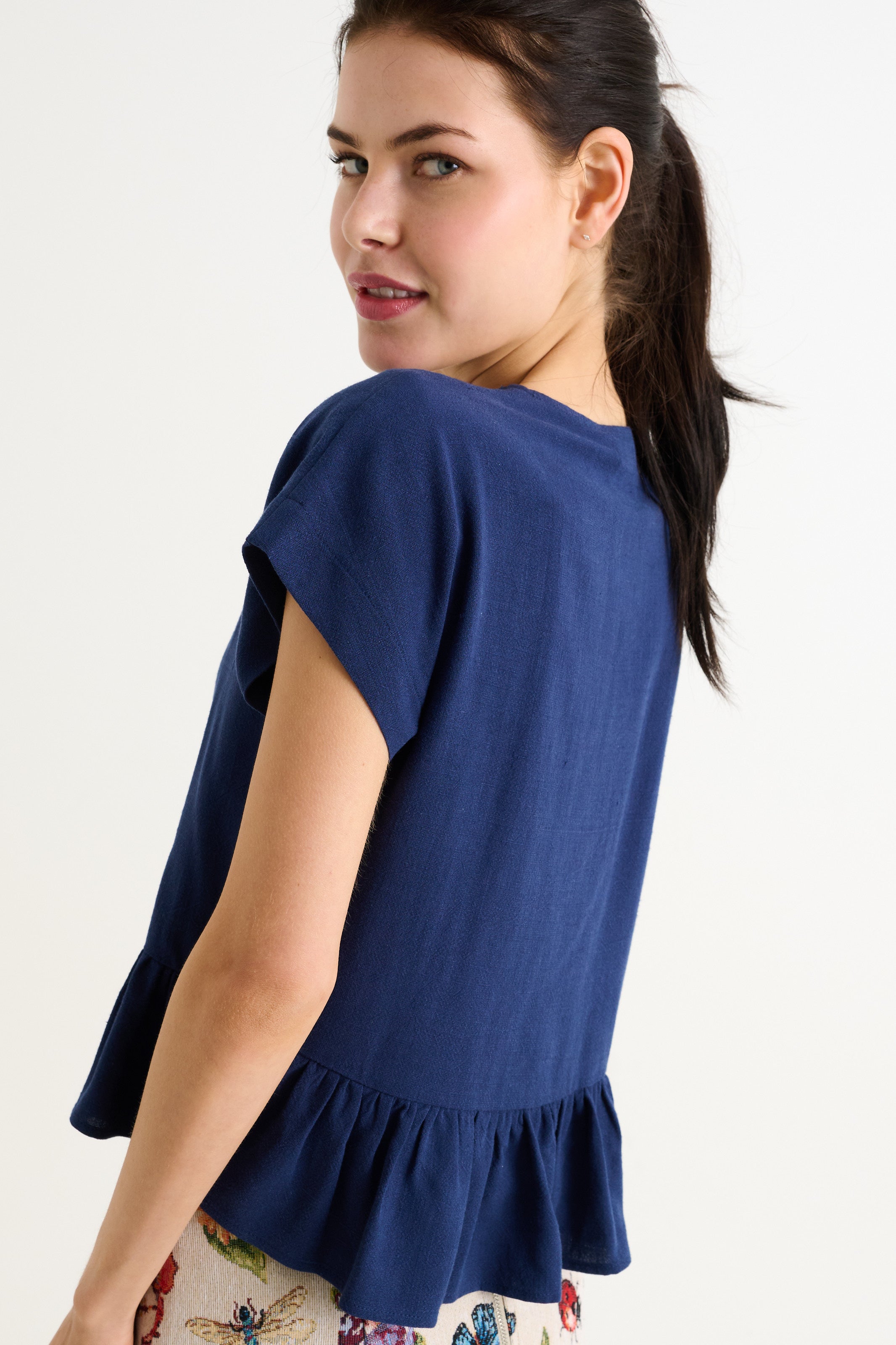 navy blue linen blend short sleeve top with button front and frill hem