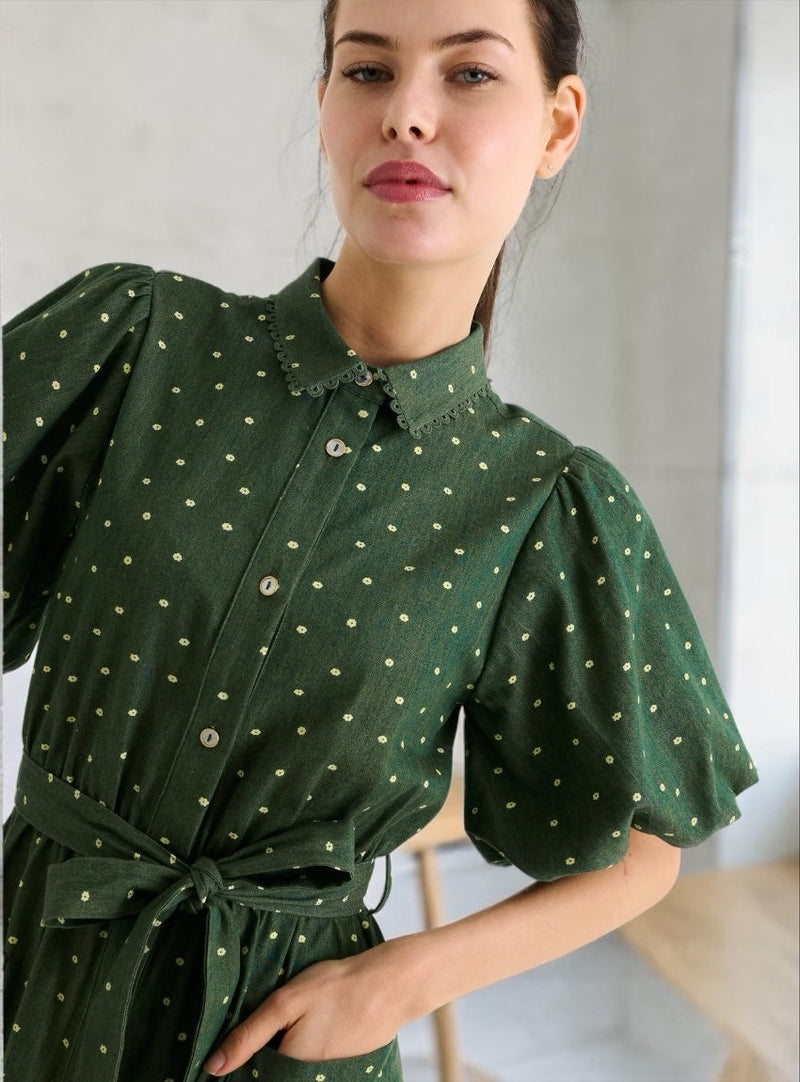 Close-up front of the Lola shirt dress in fern green, showing the scallop lace trim collar and self-tie belt.