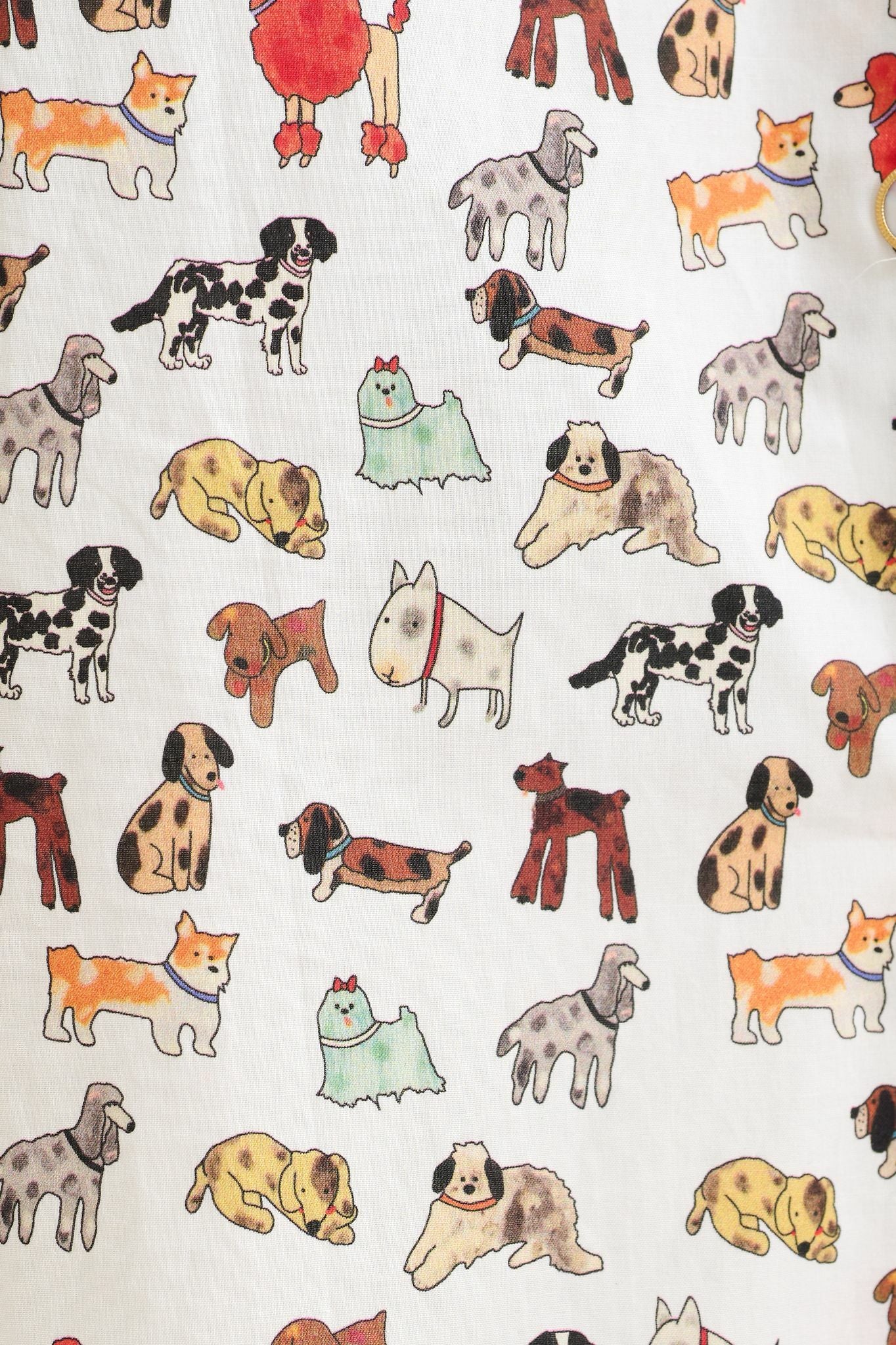 Pattern of various cartoon dogs on a white background