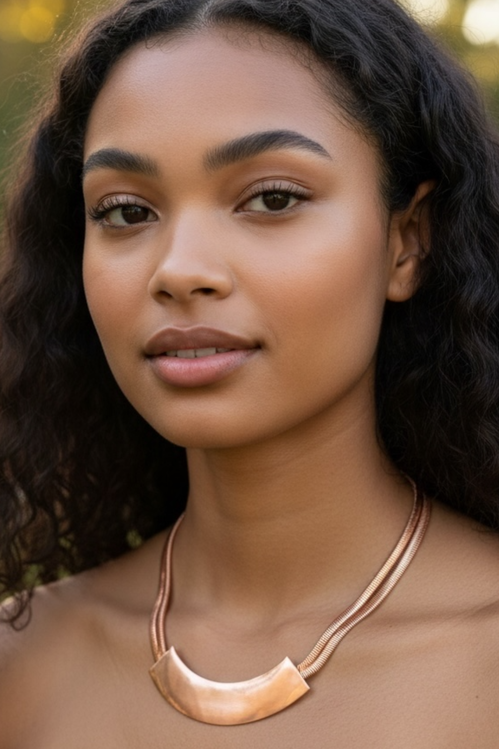 Rose gold snake chain necklace with curved brushed plate by Louche — front view