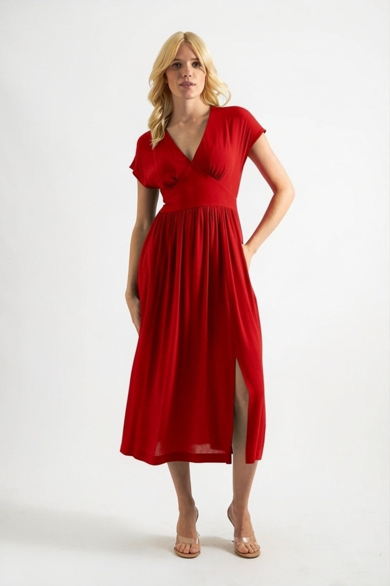 Woman wearing a red dress on a white background