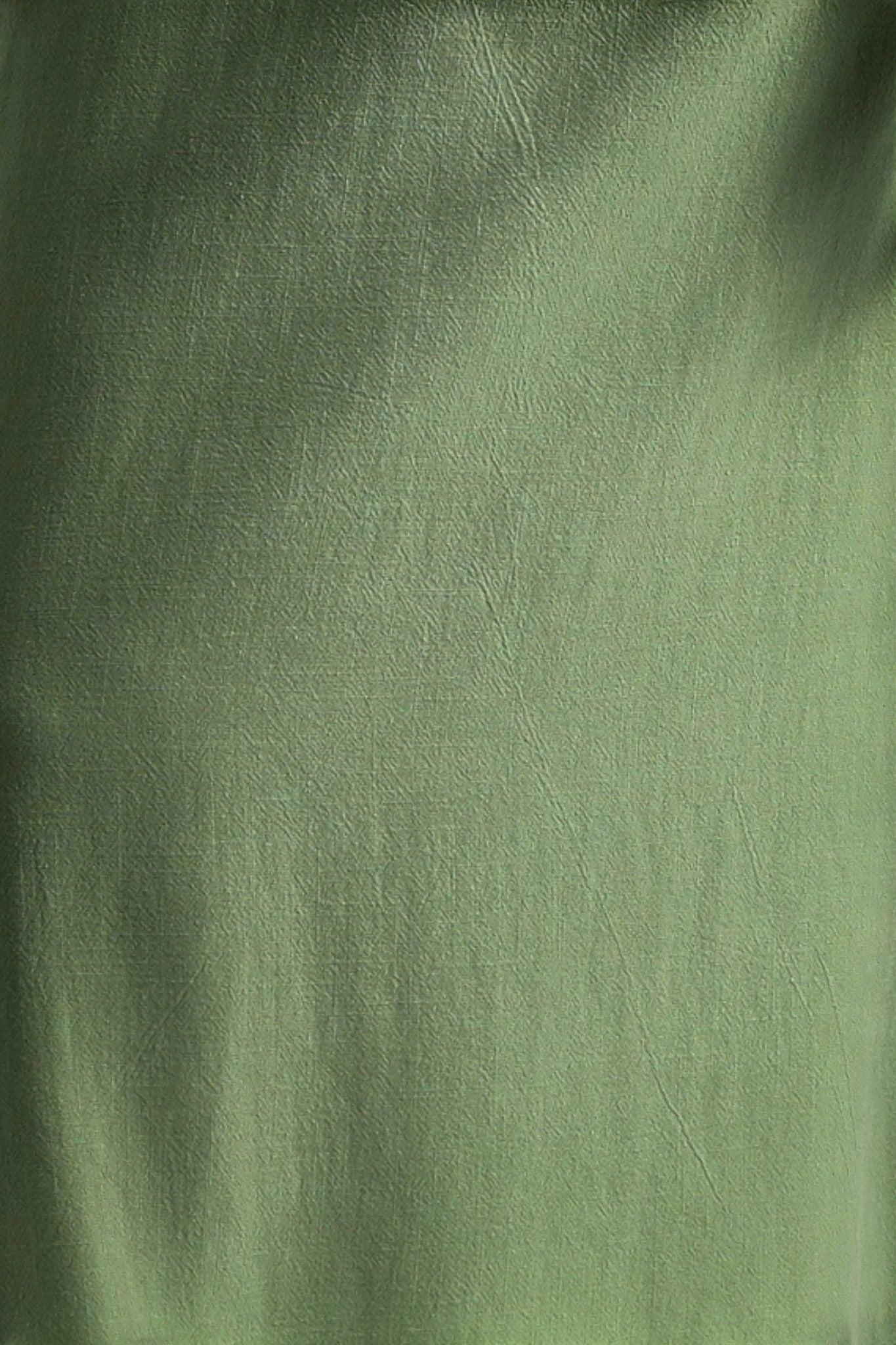 green linen mix wide-leg jumpsuit with V-neck, extended shoulders, self belt, and zip front.