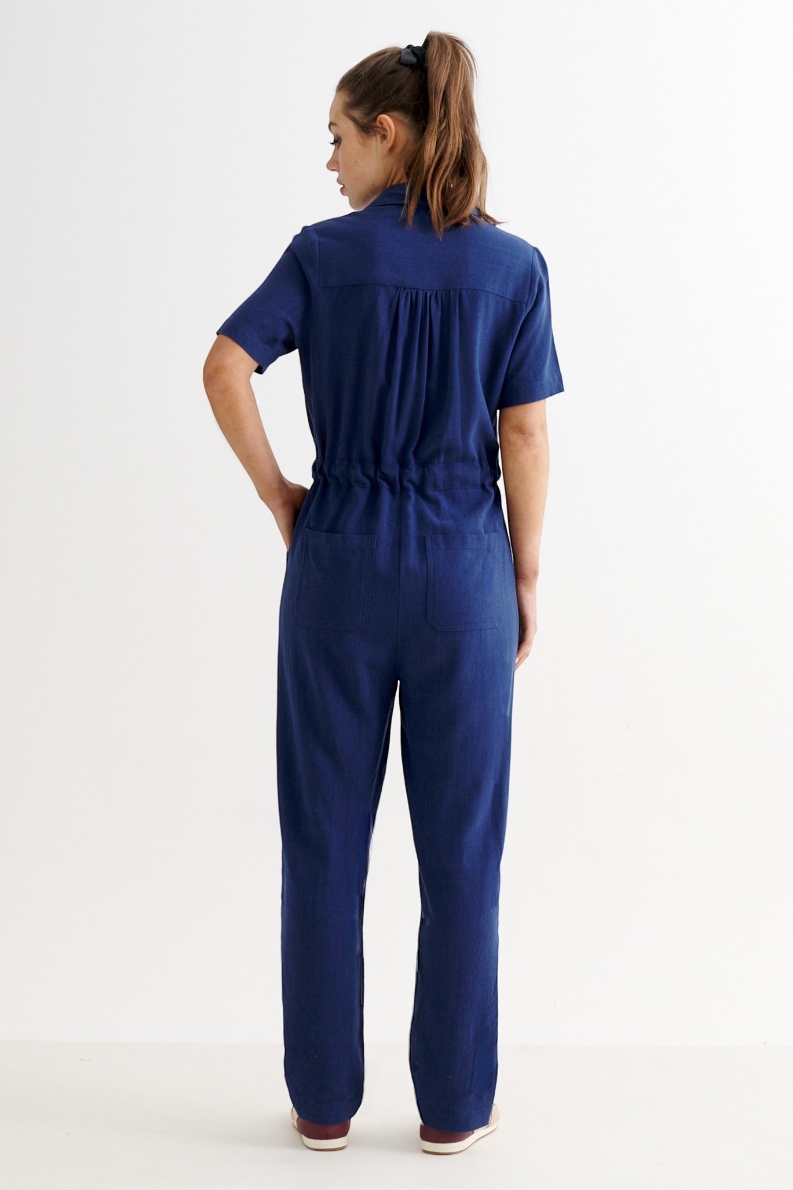 JOY navy blue linen mix short sleeve jumpsuit with drawstring waist and wooden buttons, relaxed fit.