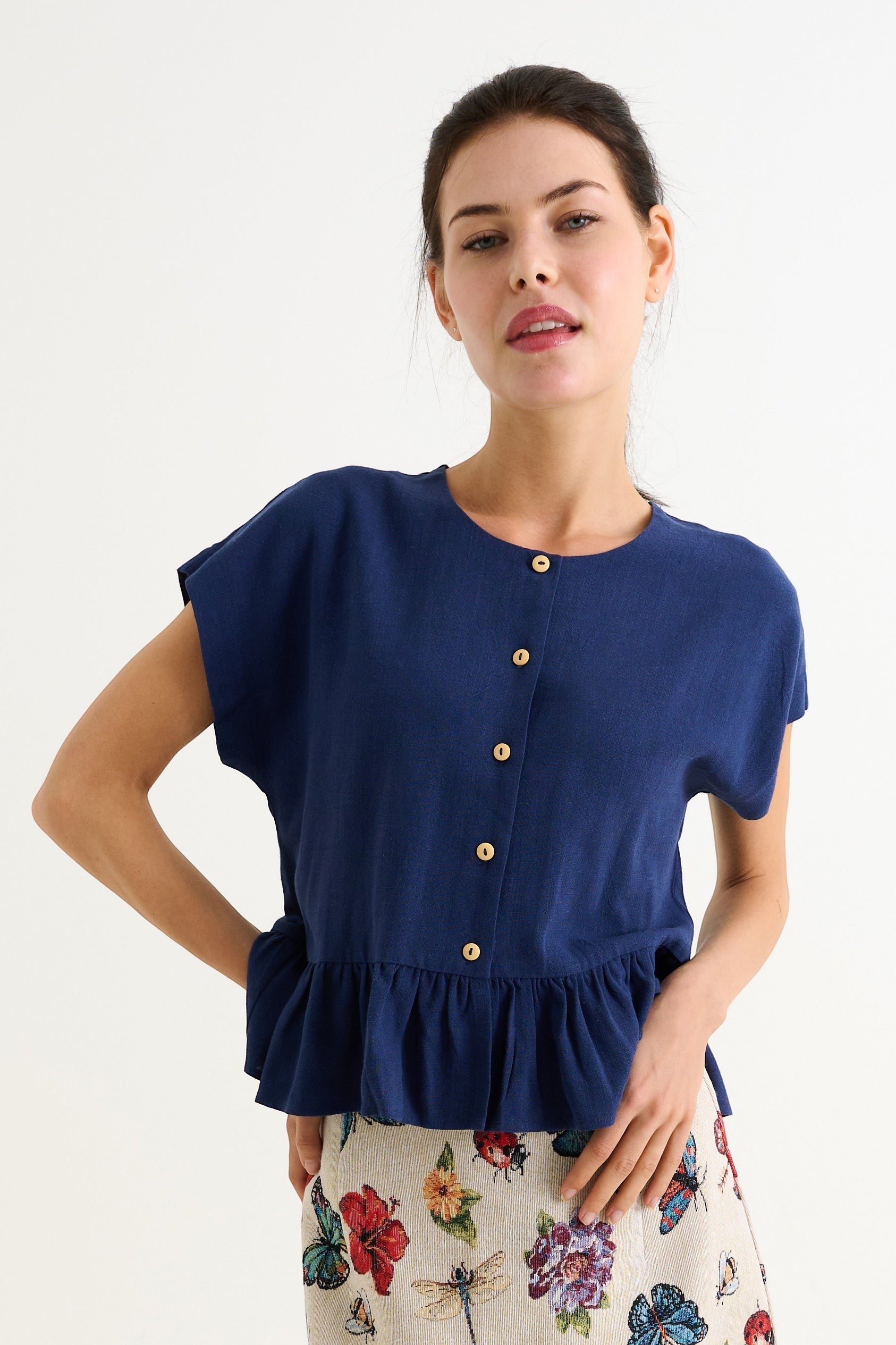 navy blue linen-viscose blend top with button-through front and flutter frill hem. Relaxed fit, extended shoulders.