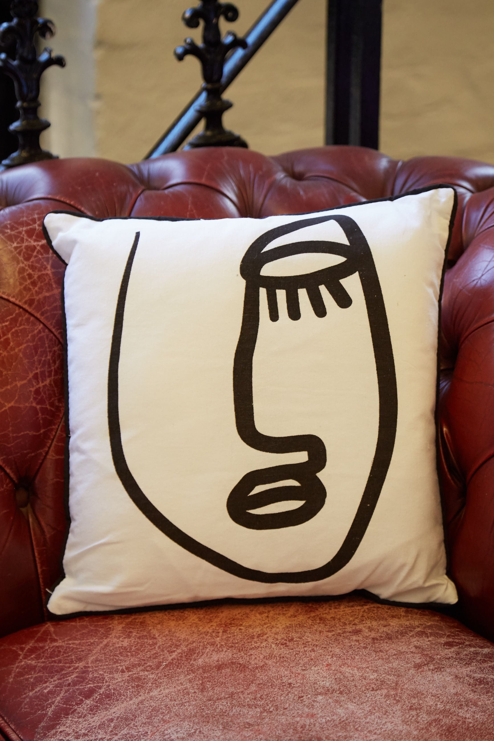 Closed Eye Face Print Cushion - Styled